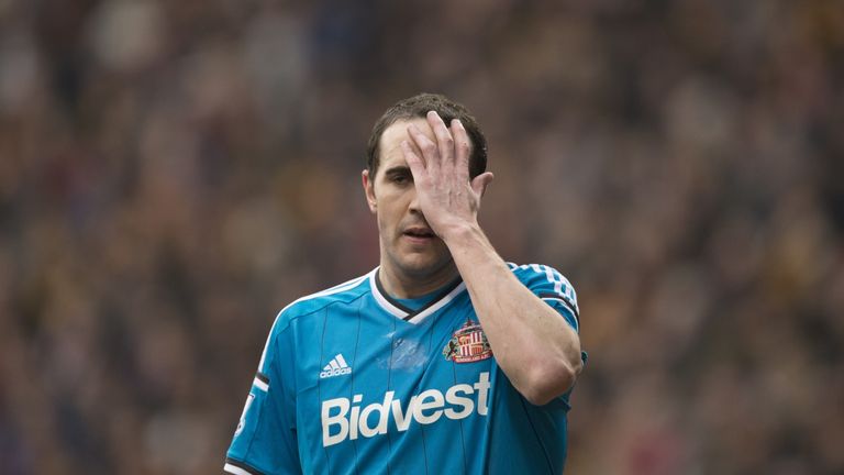 Sunderland's Irish defender John O'Shea holds his head during the FA Cup fifth round football match between Bradford City and Sunderland