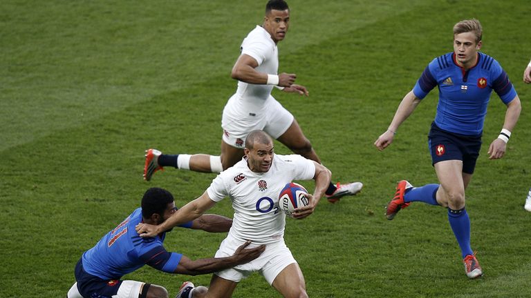 France's winger Noa Nakaitaci (L) tackles England centre Jonathan Joseph (2nd L) 