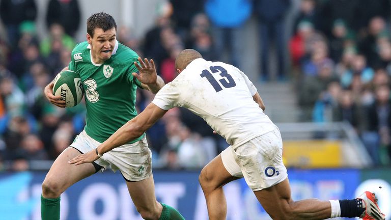 Jonathan Sexton of Ireland hands off Jonathan Joseph of England  during the RBS Six Nations match between Ireland and England