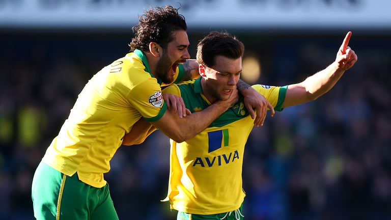 Jonny Howson of Norwich celebrates with team mate Bradley Johnson after he scores the first goal at Millwall