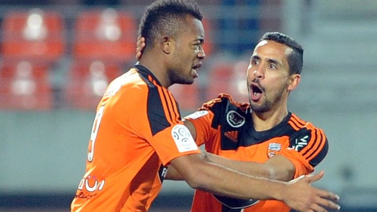 Lorient's forward Jordan Ayew (L) is congratulated by Lorient's French defender Walib Mesloub