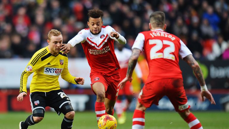 Jordan Cousins of Charlton shakes off the challenge of Alex Pritchard of Brentford during the Championship match at The Valley on February 14, 2015