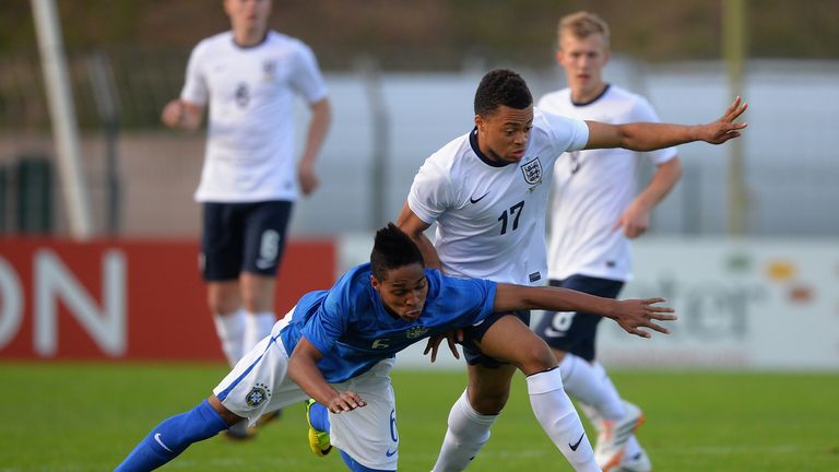 Jordan Cousins of England battles with Wendell of Brazil during the Toulon Tournament Group B match in May 2014