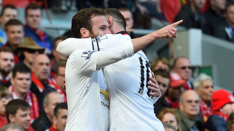 Juan Mata celebrates after scoring against Liverpool at Anfield