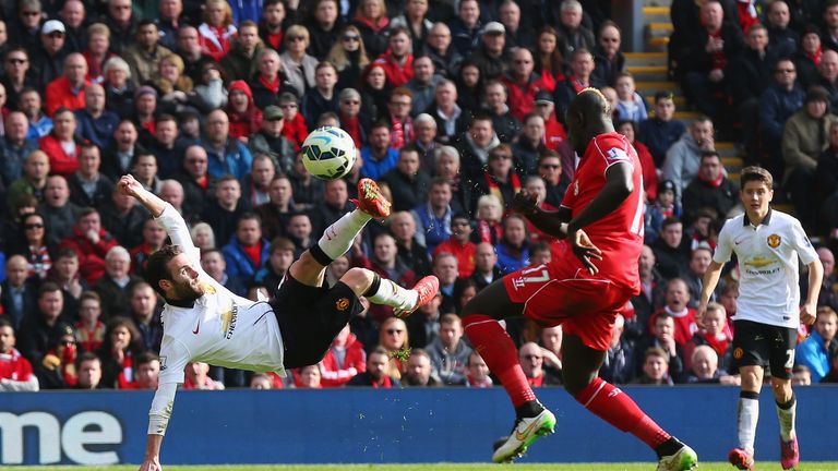 Juan Mata scores his second goal against Liverpool at Anfield