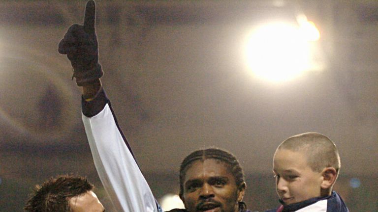 West Bromwich, UNITED KINGDOM:  West Bromwich Albion's Nwankwo Kanu celebrates (C) with a ballboy and Daren Carter after he scored his second goal in the E