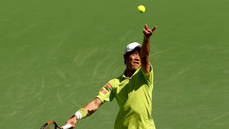 Kei Nishikori of Japan serves to Fernando Verdasco of Spain during day eight of the BNP Paribas Open at the Indian Wells Tennis