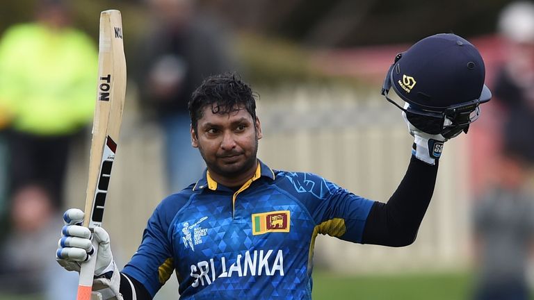 Sri Lanka batsman Kumar Sangakkara raises his bat after scoring a century at the Bellerive Oval ground during the 2015 Cricket World Cup Pool A match