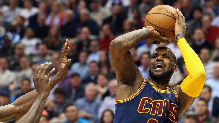 LeBron James #23 of the Cleveland Cavaliers takes a shot against the Dallas Mavericks at American Airlines Center on March 10, 2015