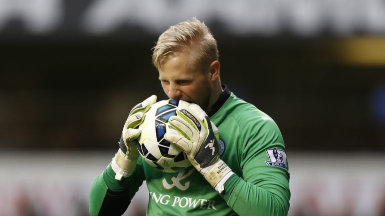 Leicester goalkeeper Kasper Schmeichel takes a bite at the ball after conceding Harry Kane's penalty