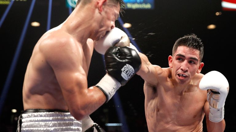 WBC super bantamweight champion Leo Santa Cruz connects with a punch on Jesus Ruiz during their title fight at the MGM Gra