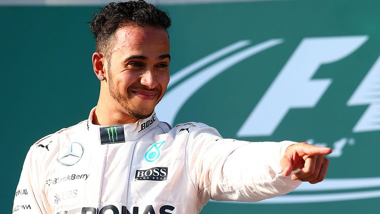  Lewis Hamilton of Great Britain and Mercedes GP celebrates on the podium after winning the Australian Formula One Grand P