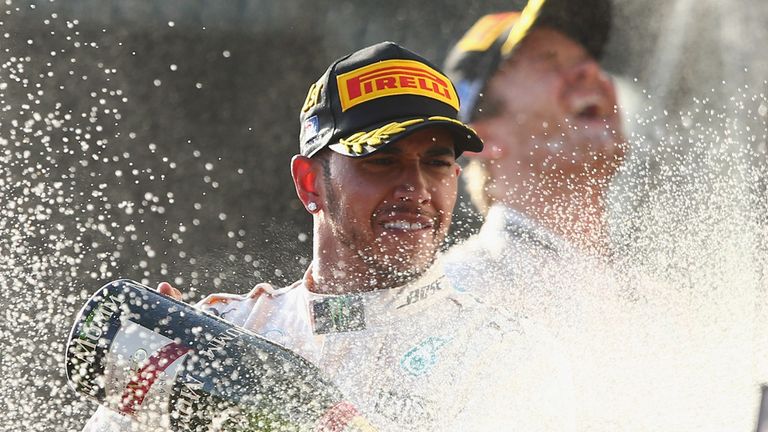 Lewis Hamilton celebrates on the podium after winning the Australian Formula One Grand P