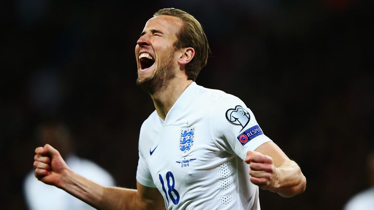 Harry Kane of England celebrates after scoring on his debut against Lithuania