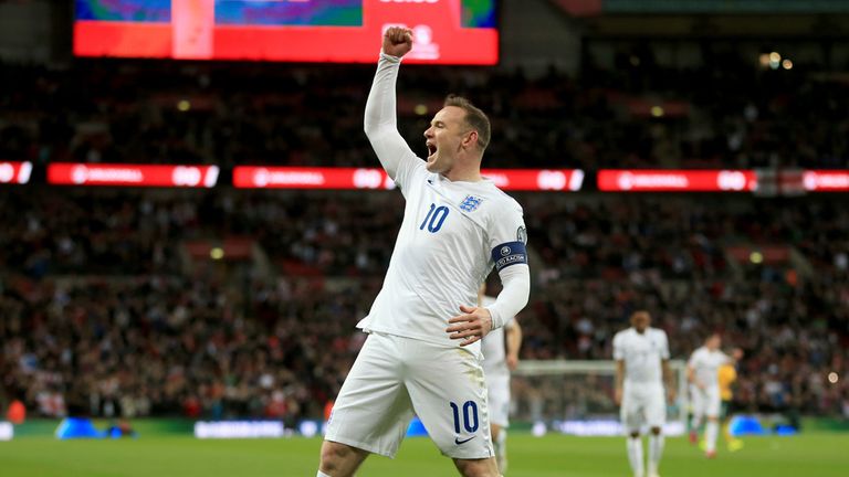 England's Wayne Rooney celebrates scoring his sides first goal against Lithuania