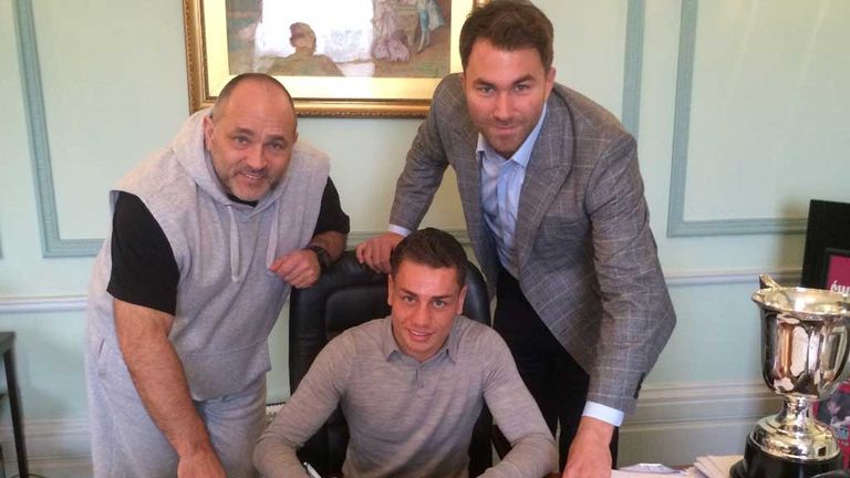 Lucien Reid signs his Matchroom deal with promoter Eddie Hearn and trainer Peter Sims