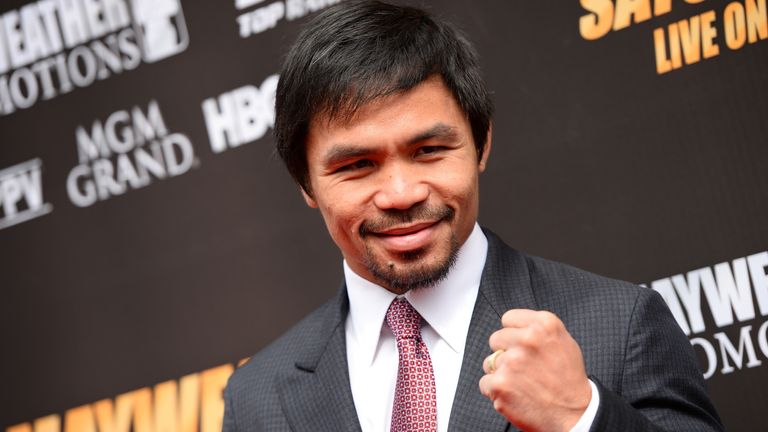 Manny Pacquiao arrives for a joint press conference with Floyd Mayweather Jr  on March 11, 2015 at the Nokia Theatre at LA Live in Los Angeles, California.