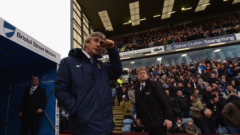 Manuel Pellegrini, manager of Manchester City walks out at Turf Moor