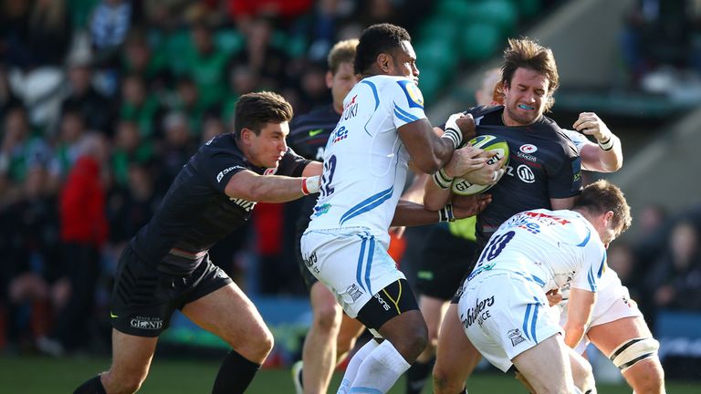 Marcelo Bosch of Saracens is tackled by Ceri Sweeney 