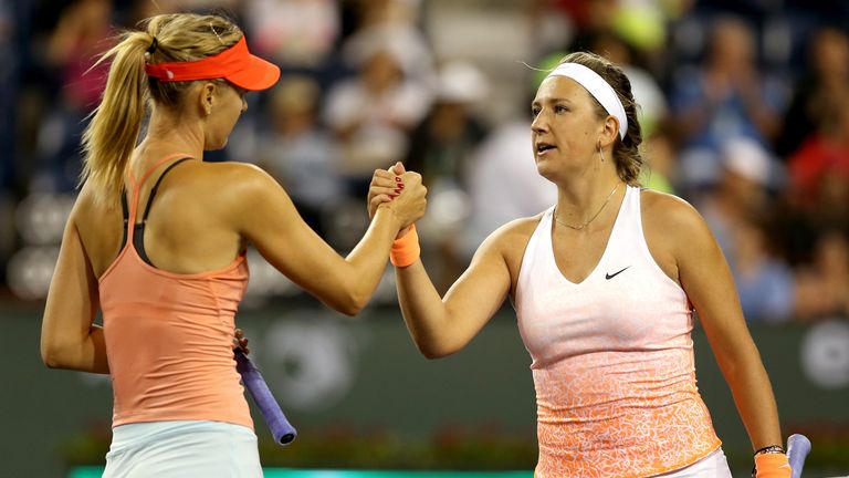 Maria Sharapova of Russia is congratulated by Victoria Azarenka of Belarus after their match during day eight of the BNP Paribas Open