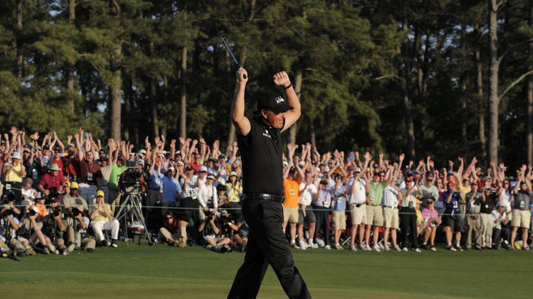 Phil Mickelson of the US after sinking his putt on the 18 hole to win the 2010 Masters Tournament at Augusta National Golf Club on April11, 2010 in Augusta