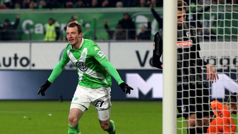 Wolfsburg's midfielder Maximilian Arnold (L) celebrates after scoring