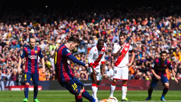 Lionel Messi of FC Barcelona scores from the penalty spot his team's third goal during the La Liga match between FC Barcelona