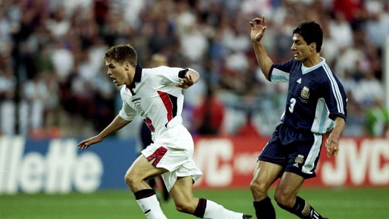 30 Jun 1998:  Michael Owen of England shrugs off Jose Chamot of Argentina on his way to goal during the World Cup second round match at the Stade Geoffroy 