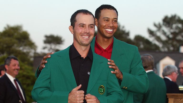 Mike Weir of Canada is presented with the green jacket by Tiger Woods of the USA after winning the play off after the final round 