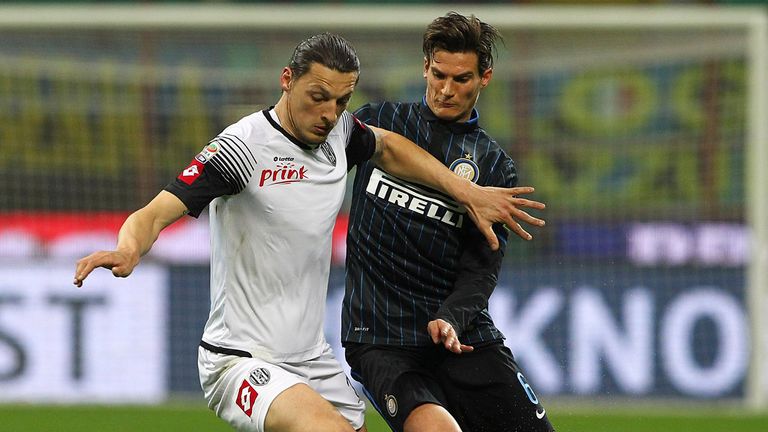 MILAN, ITALY - MARCH 15:  Milan Djuric of AC Cesena competes for the ball with Marco Andreolli of FC Internazionale Milano during the Serie A match between