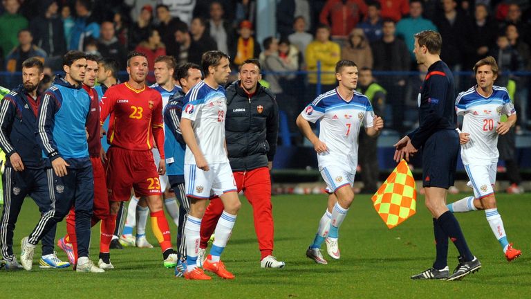 Players leave the pitch Montenegro v Russia