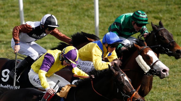 DONCASTER, ENGLAND - MARCH 28:  Martin Harley riding Naadirr (C, blue cap) win The Betway Cammidge Trophy at Doncaster racecourse on March 28, 2015 in Donc