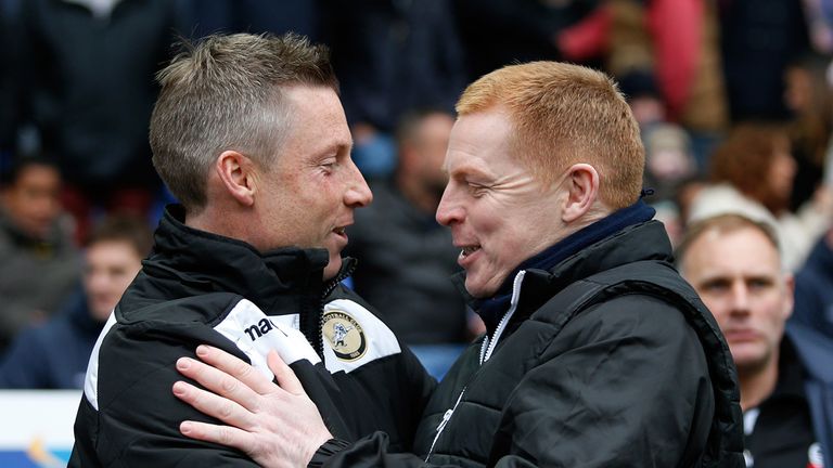 BOLTON, ENGLAND - MARCH 14: Manager Neil Lennon (R) of Bolton greets caretaker manager Neil Harris of Millwall before the Sky Bet Championship match betwee