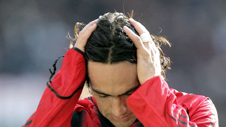 MILAN, ITALY:  AC Milan's defender Alessandro Nesta touches his head as he exits the pitch after injuring himself during an Italian Serie A match against S