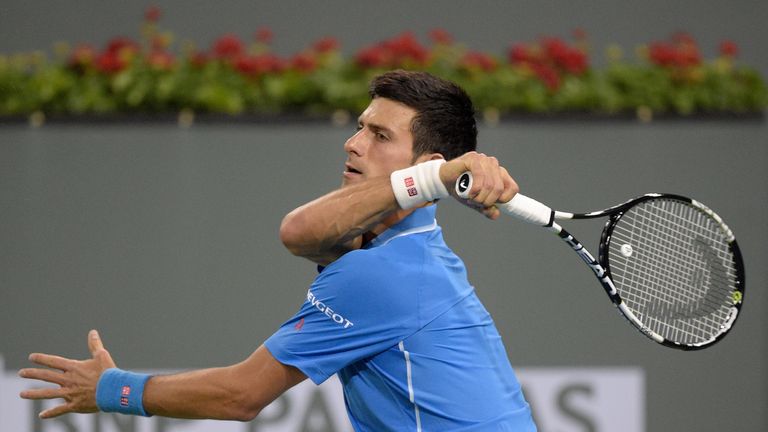 Novak Djokovic of Serbia hits a forehand in his match against Marcos Baghdatis of Cyprus during the BNP Parisbas Open at the Indian Wells Tennis Garden