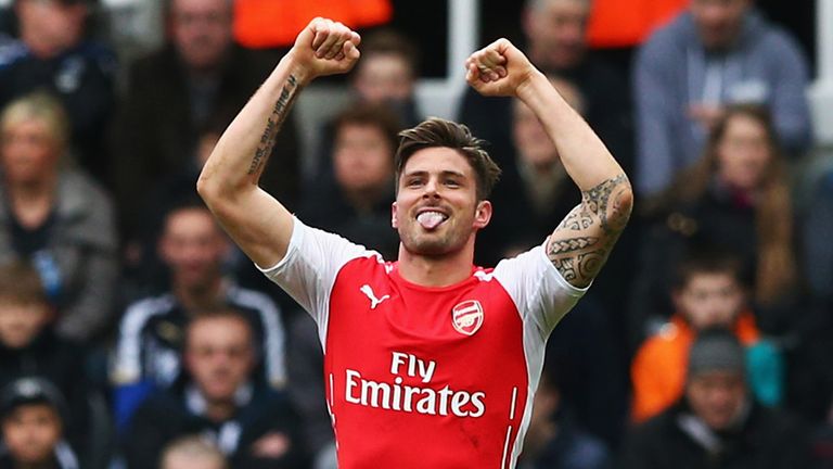 Olivier Giroud celebrates after scoring his first goal against Newcastle