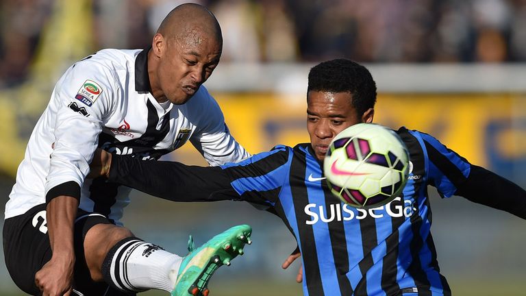 Fabiano Santacroce  is challenged by Urby Emanuelson