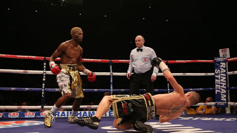 Zolani Tete knocks down Paul Butler in their IBF Super-Flyweight Championship of the World fight at the Echo Arena, Liverpool.
