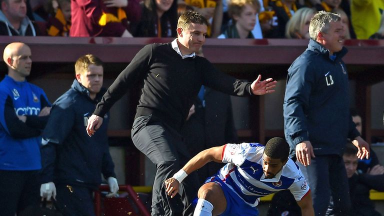 BRADFORD, ENGLAND - MARCH 07:  Phil Parkinson the manager of Bradford City collides with Garath McCleary of Reading during the FA Cup Quarter Final match b