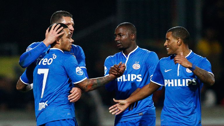 Memphis Depay is congratulated by team mates after he scores the first goal during the Eredivisie match between Go Ahead Eagles and PSV Eindhoven.
