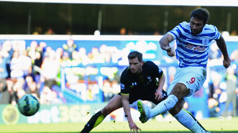 Charlie Austin of QPR shoots as Jan Vertonghen of Spurs looks on during the Barclays Premier League match in March 2015