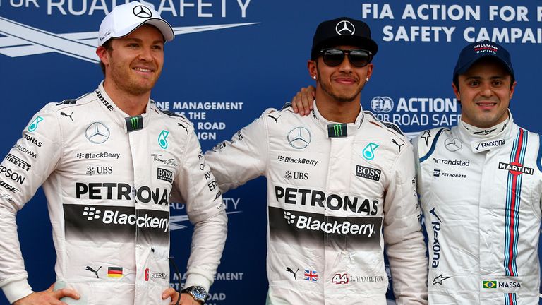 Lewis Hamilton of Great Britain and Mercedes GP stands in Parc Ferme next to Nico Rosberg of Germany and Mercedes GP and 