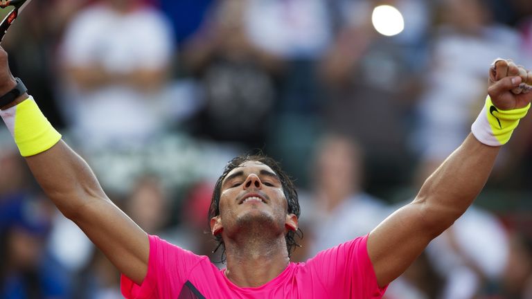 Spanish tennis player Rafael Nadal celebrates after defeating Argentine tennis player Carlos Berlocq by 7-6, 6-2