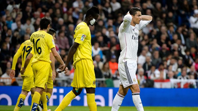 Real Madrid's Portuguese forward Cristiano Ronaldo (R) reacts during the Spanish league football match Real Madrid CF vs Villarreal CF.