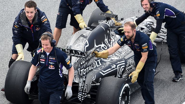 Red Bull Racing mechanics recover the car of Daniel Ricciardo (AUS) Red Bull Racing RB11 at Formula One Testing, Day Four, Barcelona, Spain, 1 March 2015..