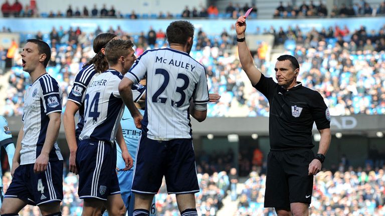 West Bromwich Albion's Northern Irish defender Gareth McAuley (2nd R) is shown the red card and sent off by English referee Neil Swarbrick