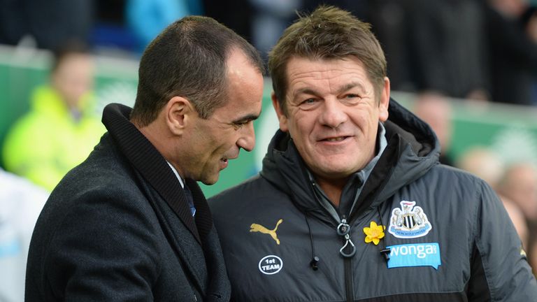LIVERPOOL, ENGLAND - MARCH 15:  Roberto Martinez, manager of Everton greets John Carver, manager of Newcastle United during the Barclays Premier League mat