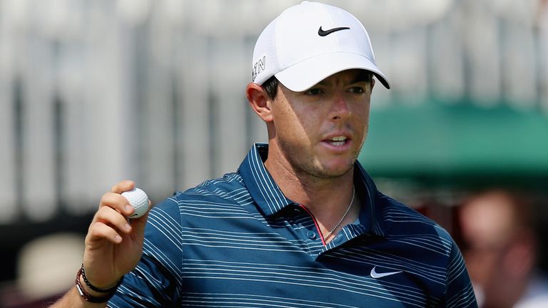 Rory McIlroy of Northern Ireland waves on the ninth green during the second round of the Arnold Palmer Invitational