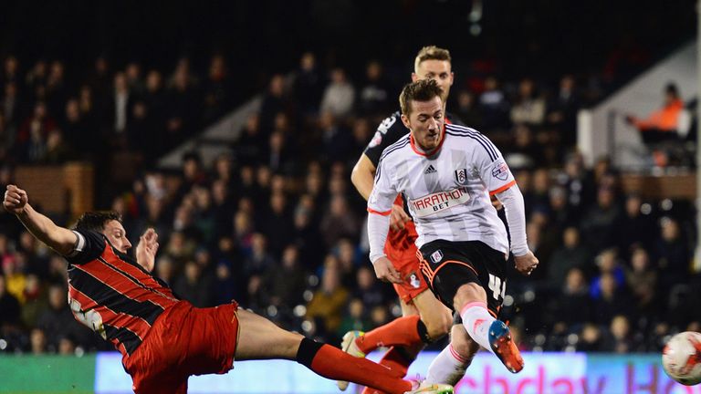 LONDON, ENGLAND - MARCH 06:  Ross McCormack of Fulham shoots past Tommy Elphick of Bournemouth 