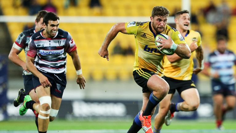 Callum Gibbins Hurricanes breaks away for a try against the Rebels